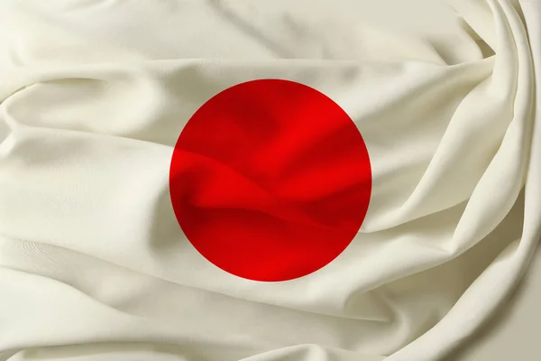 Beautiful flag of Japan on pleated fabric — Stock Photo, Image