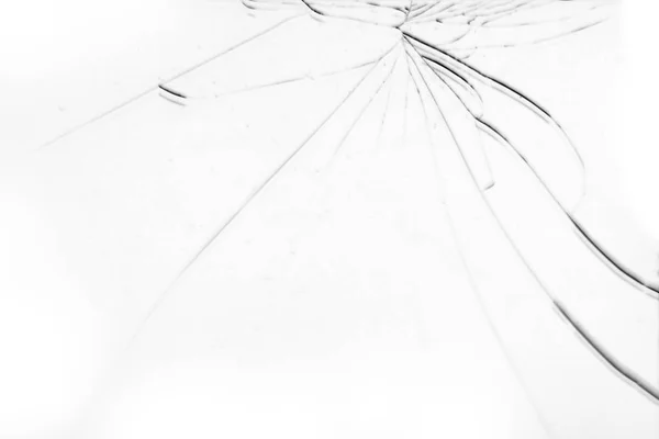 Bílé rozbité sklo s dlouhými prasklinami — Stock fotografie