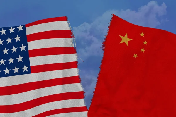two national flags of China and America are torn apart by fabric, close-up, the concept of a diplomatic gap, political and economic relations between countries