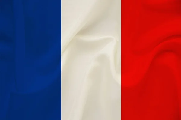 National flag of the country france on gentle silk with wind folds, travel concept, immigration, politics, copy space, close-up — Stock Photo, Image