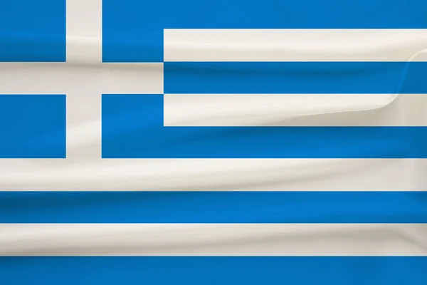 Drapeau national du pays Grèce sur soie délicate avec plis du vent, concept de voyage, immigration, politique, espace de copie, gros plan — Photo