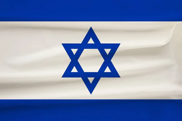 Bandera nacional del país de Israel en suave seda con pliegues de viento, concepto de viaje, inmigración, política, espacio para copias, primer plano — Foto de Stock