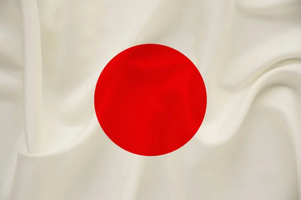 Nationalflagge des Landes Japan auf sanfter Seide mit Windfalten, Reisekonzept, Immigration, Politik, Copy Space, Nahaufnahme — Stockfoto