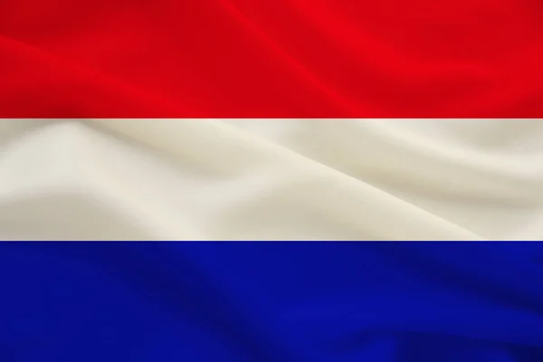 Национальный флаг Голландии на мягком шелке с ветровыми складками, концепция путешествий, иммиграция, политика, копировальное пространство, крупный план — стоковое фото