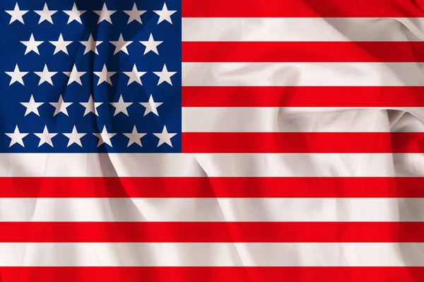 Beautiful USA national flag on soft silk with soft folds, close-up, copy space — Stock Photo, Image
