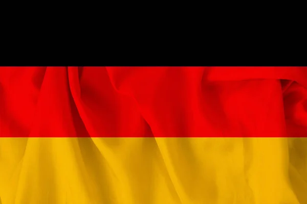 Beautiful national flag of Germany on delicate silk with soft folds, close-up, copy space — Stock Photo, Image