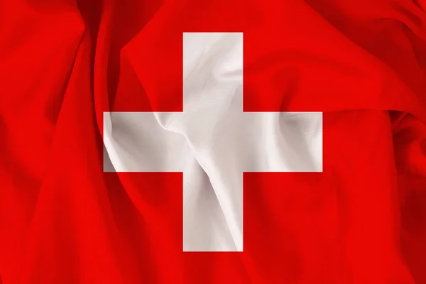 Beautiful national flag of Switzerland on a gentle silk with soft folds, close-up — Stock Photo, Image