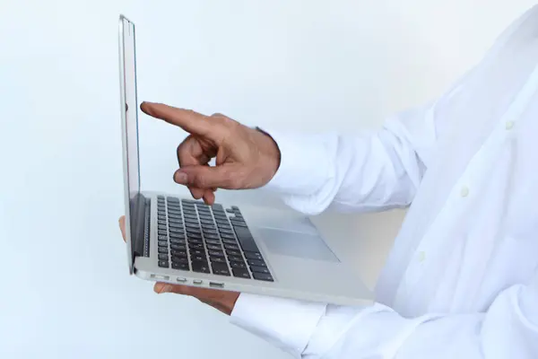 Businessman in a white shirt with a laptop in hand, close-up, copy space — Stock Photo, Image