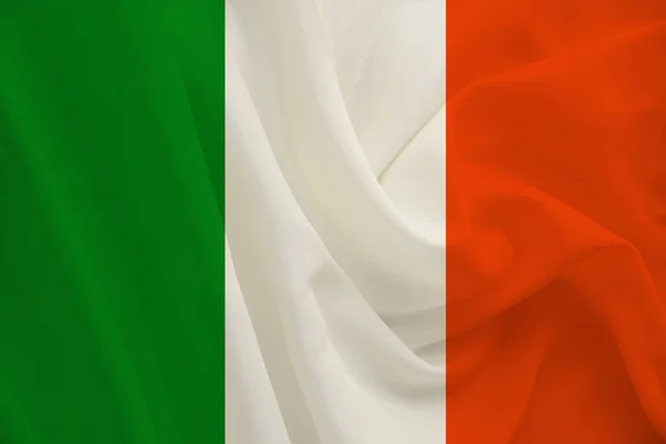 Εθνική σημαία της χώρας Ιρλανδίας για το ντελικάτο μετάξι με πτυχώσεις, σχέδιο ταξιδίου, μετανάστευση, πολιτική, αντίγραφο χώρου, κοντινό — Φωτογραφία Αρχείου