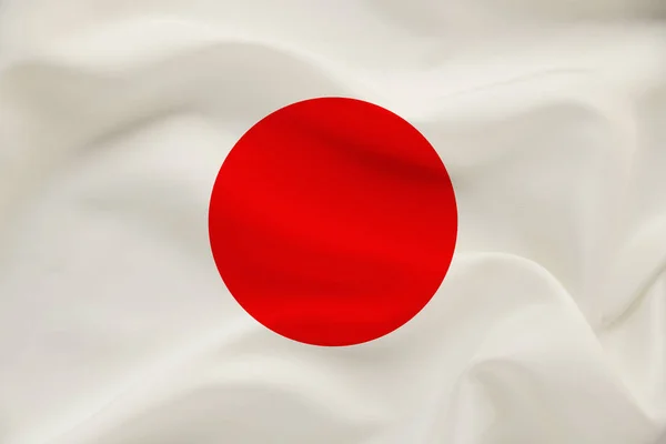Национальный флаг Японии на мягком шелке с ветровыми складками, концепция путешествий, иммиграция, политика, копировальное пространство, крупный план — стоковое фото