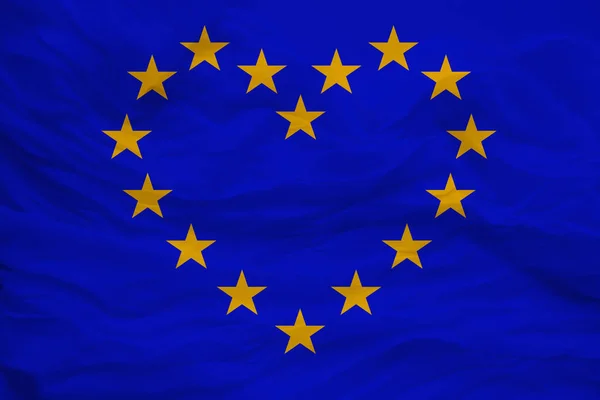 Stylizované vlajky Evropské unie, symbol sjednocené Evropy na měkkém hedvábí s měkkými záhyby, zblízka — Stock fotografie