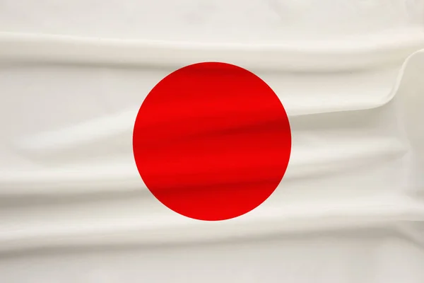 Bandeira nacional do país japão em seda suave com dobras de vento, conceito de viagem, imigração, política, espaço de cópia, close-up — Fotografia de Stock