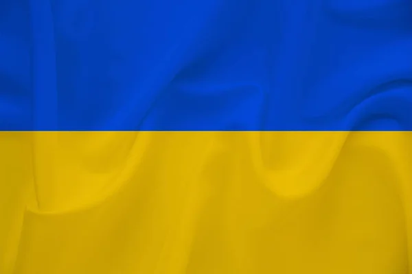 Ukrainas flagga på mild siden med vind veck, resekoncept, invandring, politik — Stockfoto