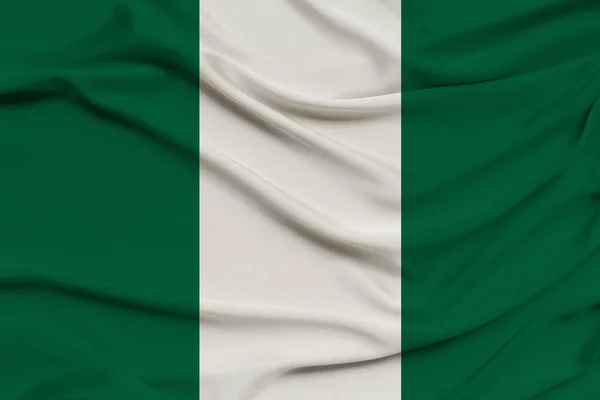 Bandera nacional de nigeria sobre tela de seda con pliegues suaves, fondo — Foto de Stock