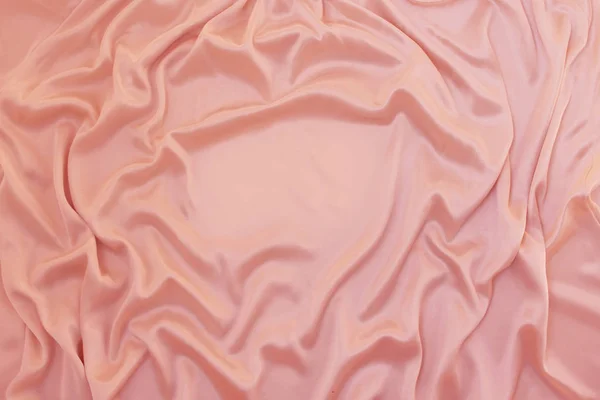 Fénykép selyemszövet, rózsaszínű. A textúra a selyem szövet. Luxus selyem szövet háttér hullámok és drapéria. Háttér divat-luxus design, közeli, másolási tér — Stock Fotó