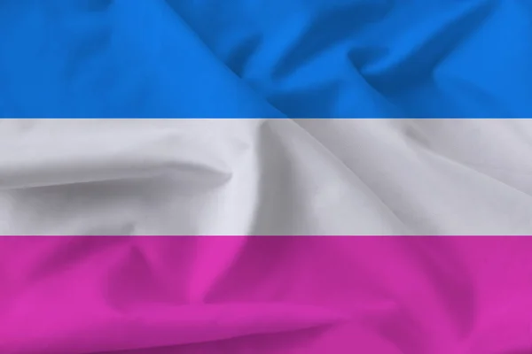 pink-white-blue flag on silk with waves from the wind, symbol of a normal heterosexual family, concept opposition LGBT rainbow flag, Pride flag, close-up