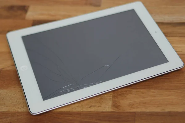 broken tablet with broken glass, in need of repair, top view, copy space