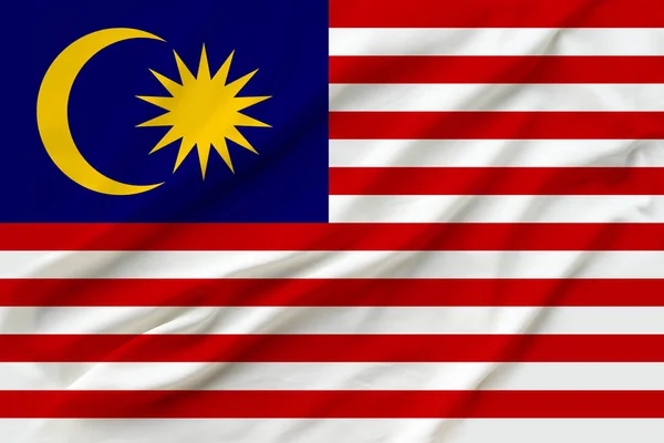 Beautiful photo of the national flag of Malaysia on delicate shiny silk with soft draperies, the concept of state power, country life, horizontal, close-up, copy space — Stock Photo, Image