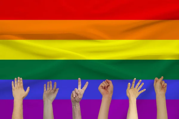 Lgbt gökkuşağı bayrağı, Gurur bayrağı, Özgürlük bayrağı arka planda birçok kişinin elleri - lezbiyen, gey, biseksüel ve transseksüel toplumun uluslararası sembolü, kavramı — Stok fotoğraf