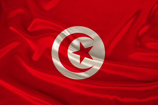 Photo du drapeau national de Tunisie sur une texture luxueuse de satin, soie avec vagues, plis et faits saillants, gros plan, espace de copie, illustration — Photo