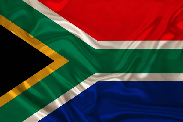 Foto van de nationale vlag van Zuid-Afrika op een luxueuze textuur van satijn, zijde met golven, plooien en hoogtepunten, close-up, kopieerruimte, reisconcept, economie en staatsbeleid, illustratie — Stockfoto