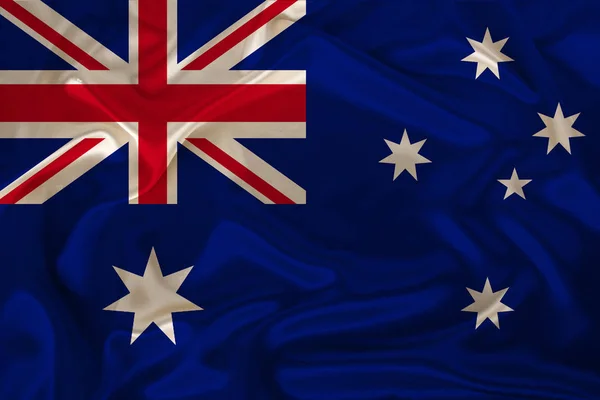 Fotografía de la bandera nacional de Australia en una textura lujosa de satén, seda con olas, pliegues y reflejos, primer plano, espacio para copiar, concepto de viaje, economía y política de estado, ilustración — Foto de Stock