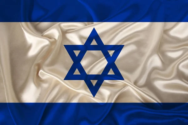 Foto van de nationale vlag van Israël op een luxe textuur van satijn, zijde met golven, plooien en hoogtepunten, close-up, kopieer ruimte, concept van reizen, economie en staatsbeleid, illustratie — Stockfoto