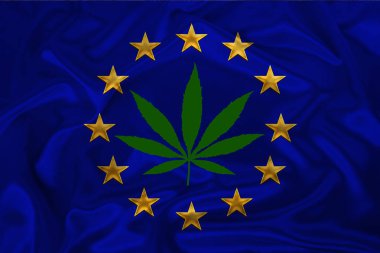 kenevir yeşil yaprak ve Avrupa Birliği'nin güzel bir ipek ulusal bayrak, tıbbi esrar kavramı, uyuşturucu yasallaştırma, uyuşturucu kaçakçılığı suçları, yakın çekim