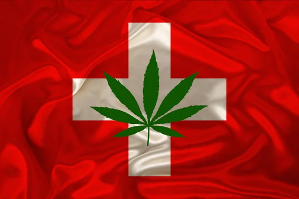 Folha verde de cânhamo e bela bandeira nacional de seda da Suíça, conceito de cannabis medicinal, legalização de drogas, crime de tráfico de drogas, close-up — Fotografia de Stock