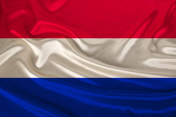 Bandera nacional del país Holanda sobre suave seda con pliegues de viento, concepto de viaje, inmigración, política, espacio para copiar, primer plano — Foto de Stock