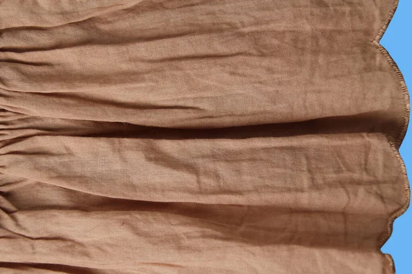 Crumpled corrugated cotton fabric into small creases and folds, background, horizontal, close-up, copy space — Stock Photo, Image