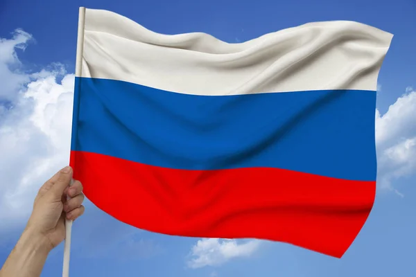 Foto de la hermosa bandera nacional de color del estado moderno de Rusia en tela texturizada, concepto de turismo, emigración, economía y política, primer plano — Foto de Stock