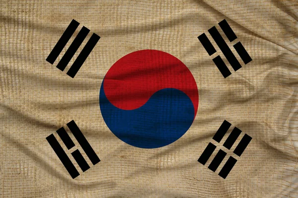 Photo of the beautiful colored national flag of the modern state of South Korea on textured fabric, concept of tourism, emigration, economics and politics, closeup — ストック写真