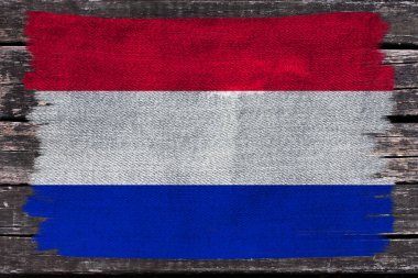 Hollanda 'nın modern devletinin turizm, ekonomi ve siyaset konsepti üzerindeki güzel renkli ulusal bayrağının fotoğrafı, yakın plan