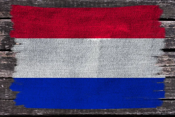 Photo du beau drapeau national coloré de l'état moderne des Pays-Bas sur le tissu texturel, concept de tourisme, économie et politique, gros plan — Photo