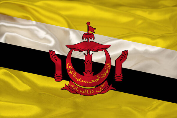 beautiful photo of the colored national flag of the modern state of Brunei on a textured fabric, concept of tourism, emigration, economics and politics, closeup