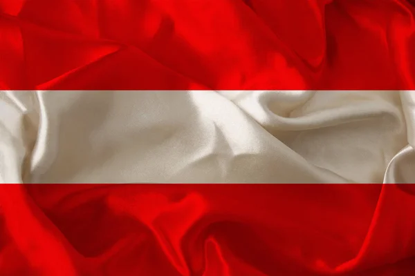 Fotografía de la hermosa bandera nacional de color del estado moderno de Austria sobre tela texturizada, concepto de turismo, economía y política, primer plano — Foto de Stock