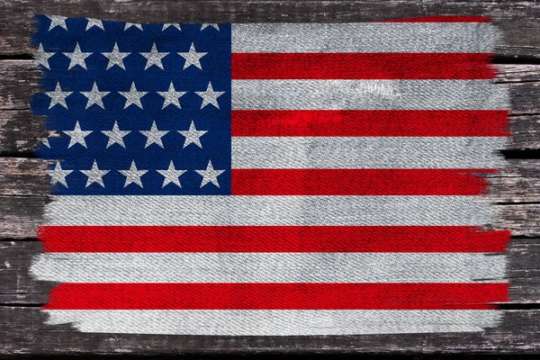 Photo of the beautiful colored national flag of the modern state of USA on textured fabric, concept of tourism, emigration, economics and politics, closeup — Stock Photo, Image