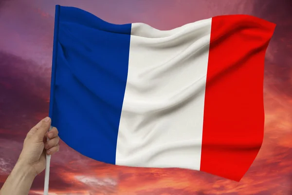 Foto della bella bandiera nazionale colorata dello stato moderno della Francia su tessuto strutturato, concetto di turismo, emigrazione, economia e politica, primo piano — Foto Stock