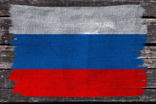 Photo of the national flag of Russia on a luxurious texture of satin, silk with waves, folds and highlights, close-up, copy space, concept of travel, economy and state policy, illustration — Stock Photo, Image