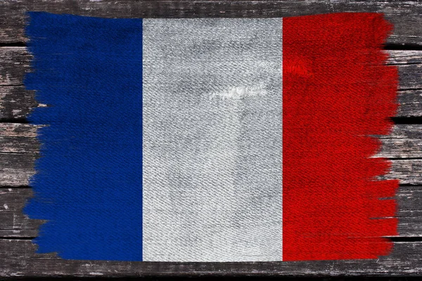 Foto da bela bandeira nacional colorida do estado moderno da França em tecido texturizado, conceito de turismo, emigração, economia e política, close-up — Fotografia de Stock