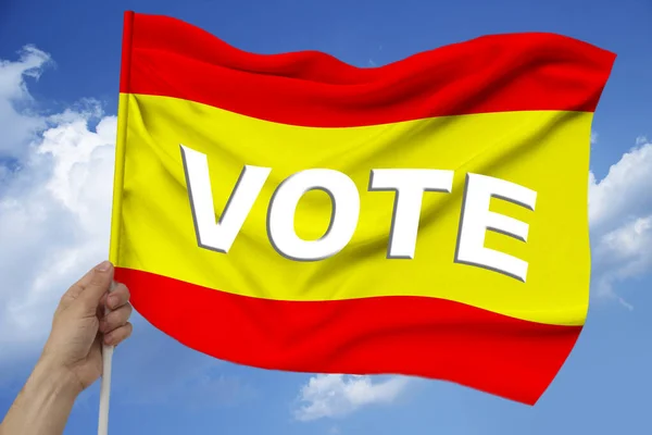 Photo of the beautiful colored national flag of the modern state of Spain on a textured fabric, concept of tourism, economics and politics, closeup — ストック写真