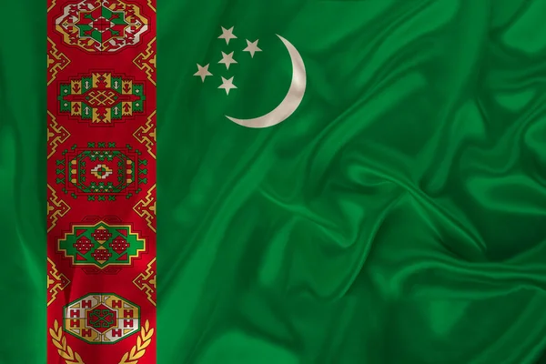 Krásná fotografie barevné národní vlajky moderního státu Turkmenistán na texturované tkaniny, koncept cestovního ruchu, emigrace, ekonomika a politika, zblízka — Stock fotografie