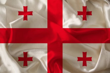 Modern Gürcistan 'ın renkli bayrağının renkli kumaş, turizm, göç, ekonomi ve siyaset konsepti üzerine güzel bir fotoğrafı.