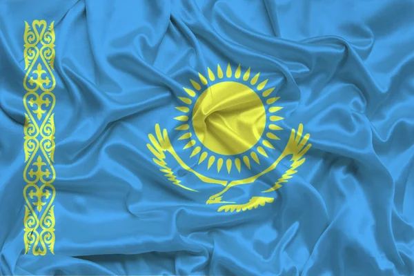 beautiful photo of a colored national flag of the modern state of Kazakhstan on a textured fabric, concept of tourism, emigration, economy and politics, closeup
