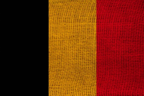 Photo of the national flag of Belgium on a luxurious texture of satin, silk with waves, folds and highlights, close-up, copy space, travel concept, economy and state policy — Stock Photo, Image