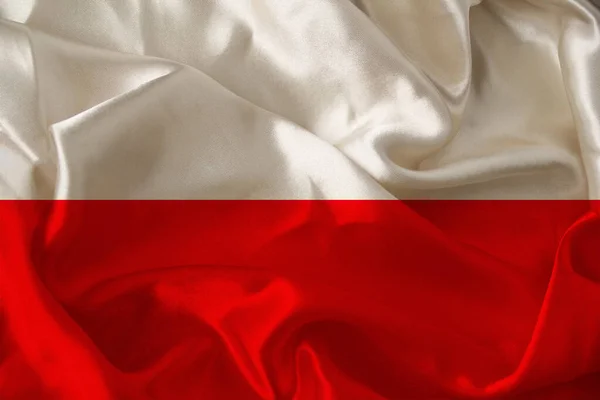 Belle photo du drapeau national coloré de l'état moderne de la Pologne sur le tissu texturel, concept de tourisme, émigration, économie et politique, gros plan — Photo