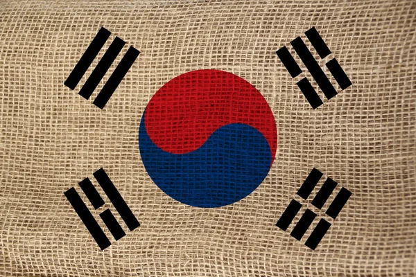 Foto van de prachtige gekleurde nationale vlag van de moderne staat Zuid-Korea op gestructureerde stof, concept van toerisme, emigratie, economie en politiek, Close-up — Stockfoto