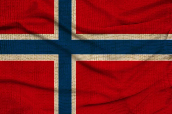 Beautiful photo of the colored national flag of the modern state of Norway on textured fabric, concept of tourism, emigration, economics and politics, close up — Stock Photo, Image