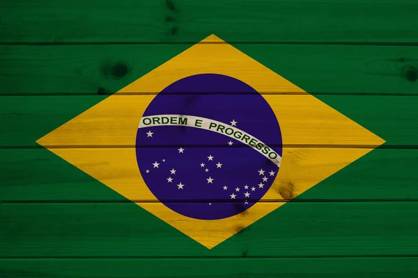 Foto van de nationale vlag van Brazilië op een luxueuze textuur van satijn, zijde met golven, plooien en highlights, close-up, kopieerruimte, reisconcept, economie en staatsbeleid — Stockfoto